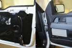 After thorough application of sound deadening to the door, the black vapor barrier is reinstalled and the Focal K2 power midrange is mounted to a custom built adapter plate. 